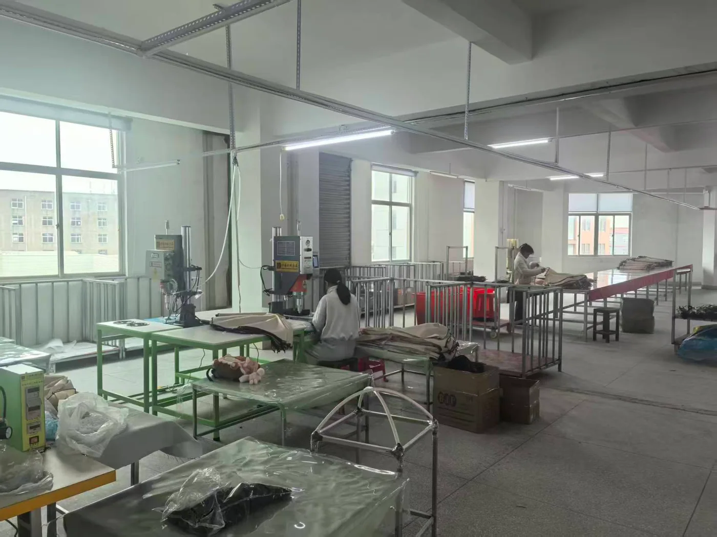 umbrella factory production workshop overview with worktables and umbrella components