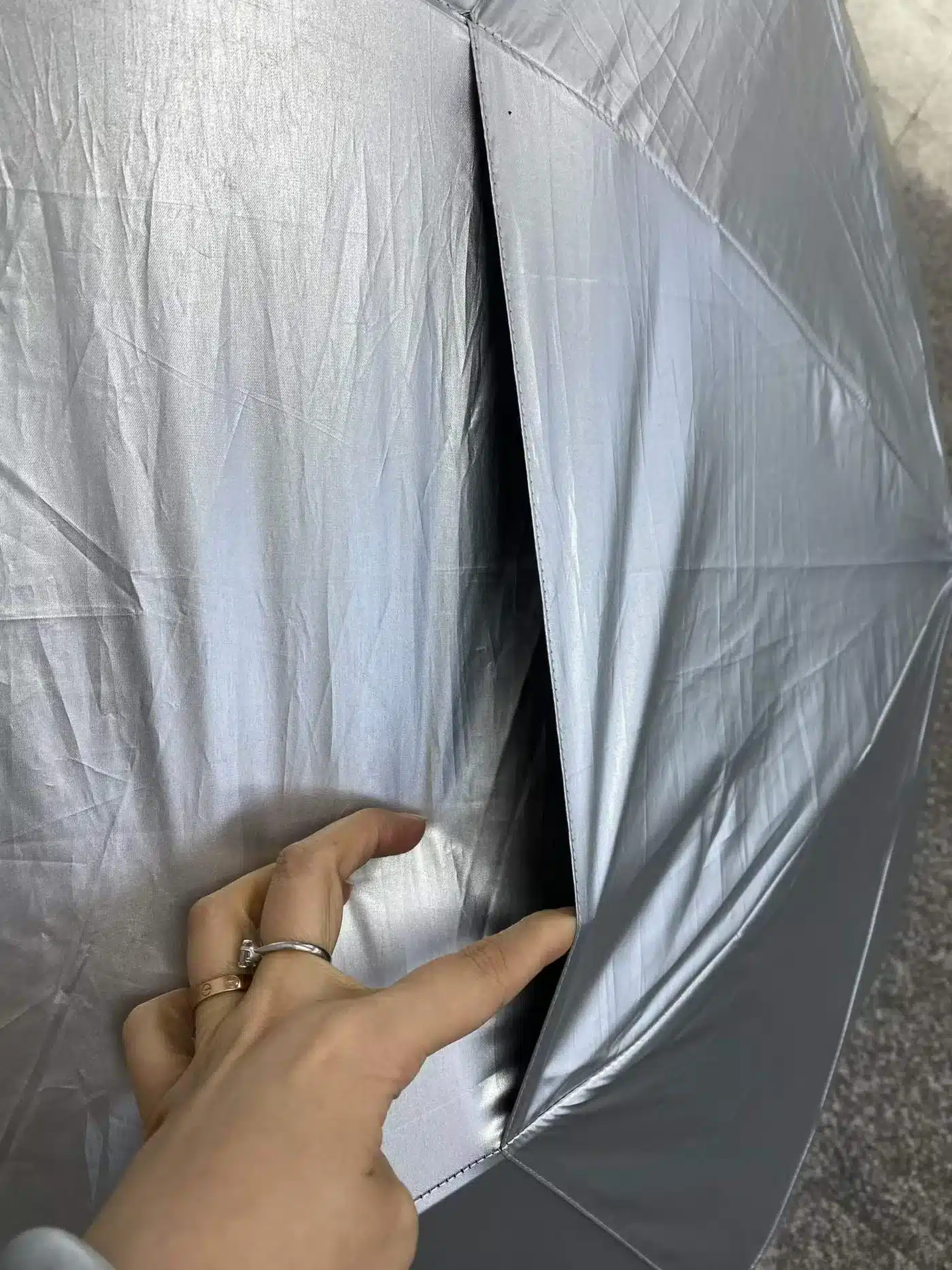 Silver coated umbrella canopy and seam close-up