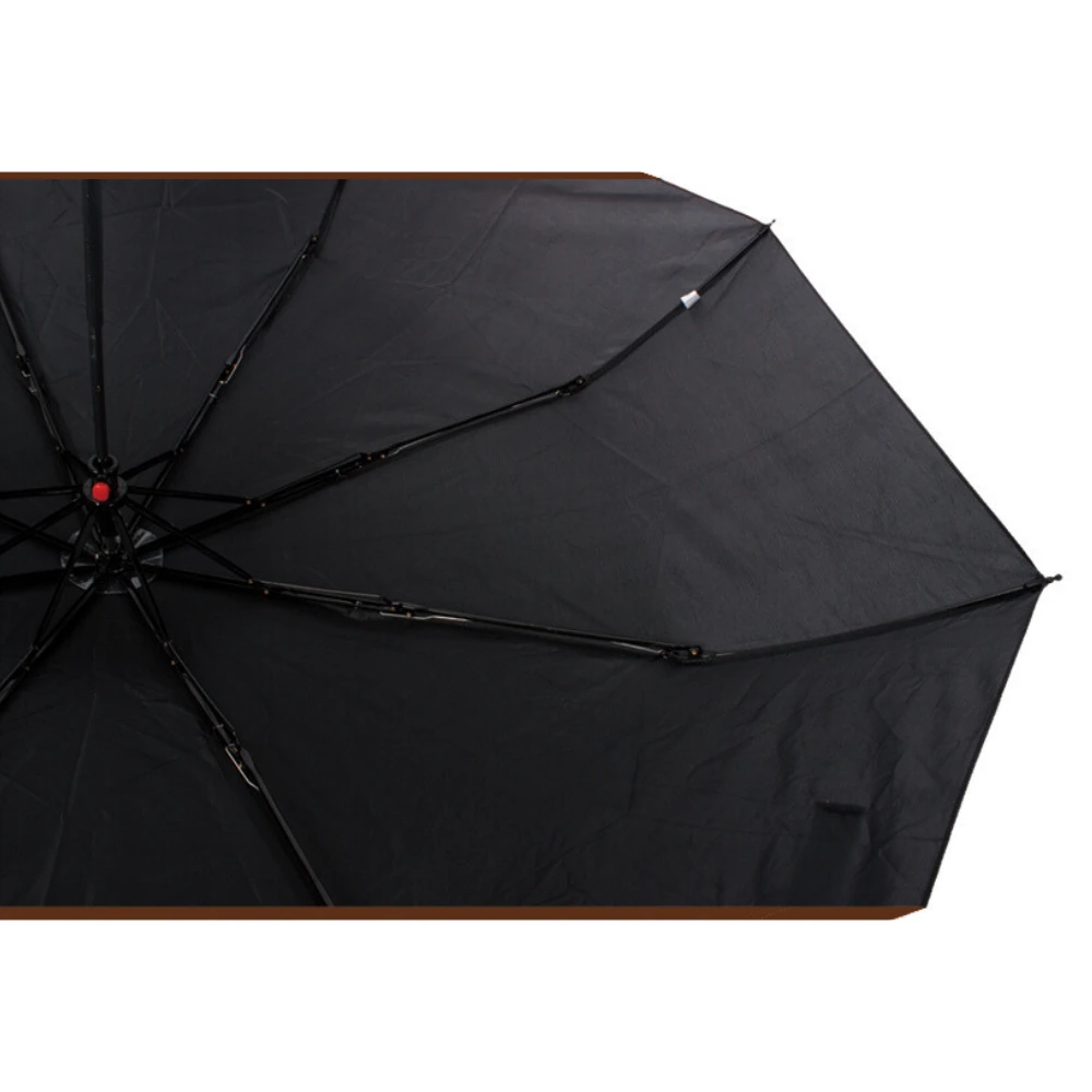 Black folding umbrella canopy underside with visible ribs